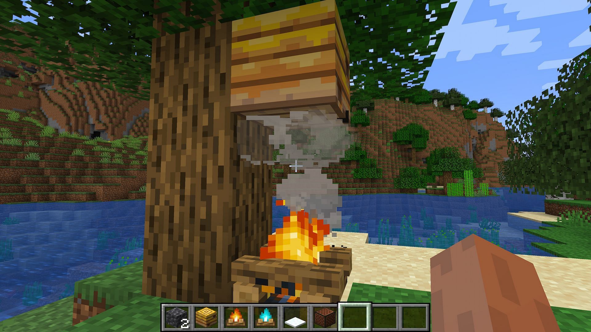 Players can use campfires for farming honey without harming the bees (Image via Minecraft)