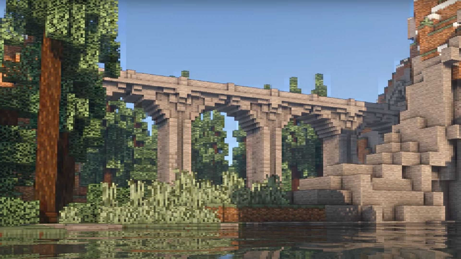 Ce pont de pierre utilise un style d'arc astucieux qui le fait ressortir et ressemble à une véritable œuvre d'art Minecraft (Image via Master Majesty/YouTube)