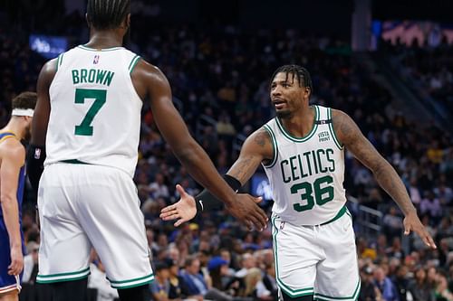 Marcus Smart of the Celtics celebrates with Jaylen Brown after a basket