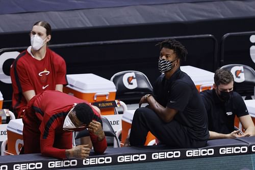 Udonis Haslem and Jimmy Butler of the Miami Heat look on from the bench against the Denver Nuggets at American Airlines Arena on January 27 in Miami, Florida.