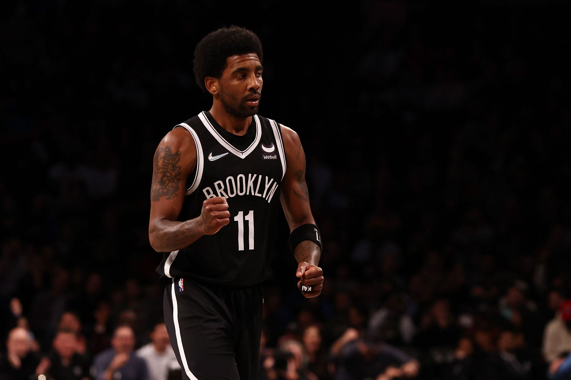 Kyrie Irving of the Brooklyn Nets pumps his fist against the Charlotte Hornets at Barclays Center on Sunday in New York City.