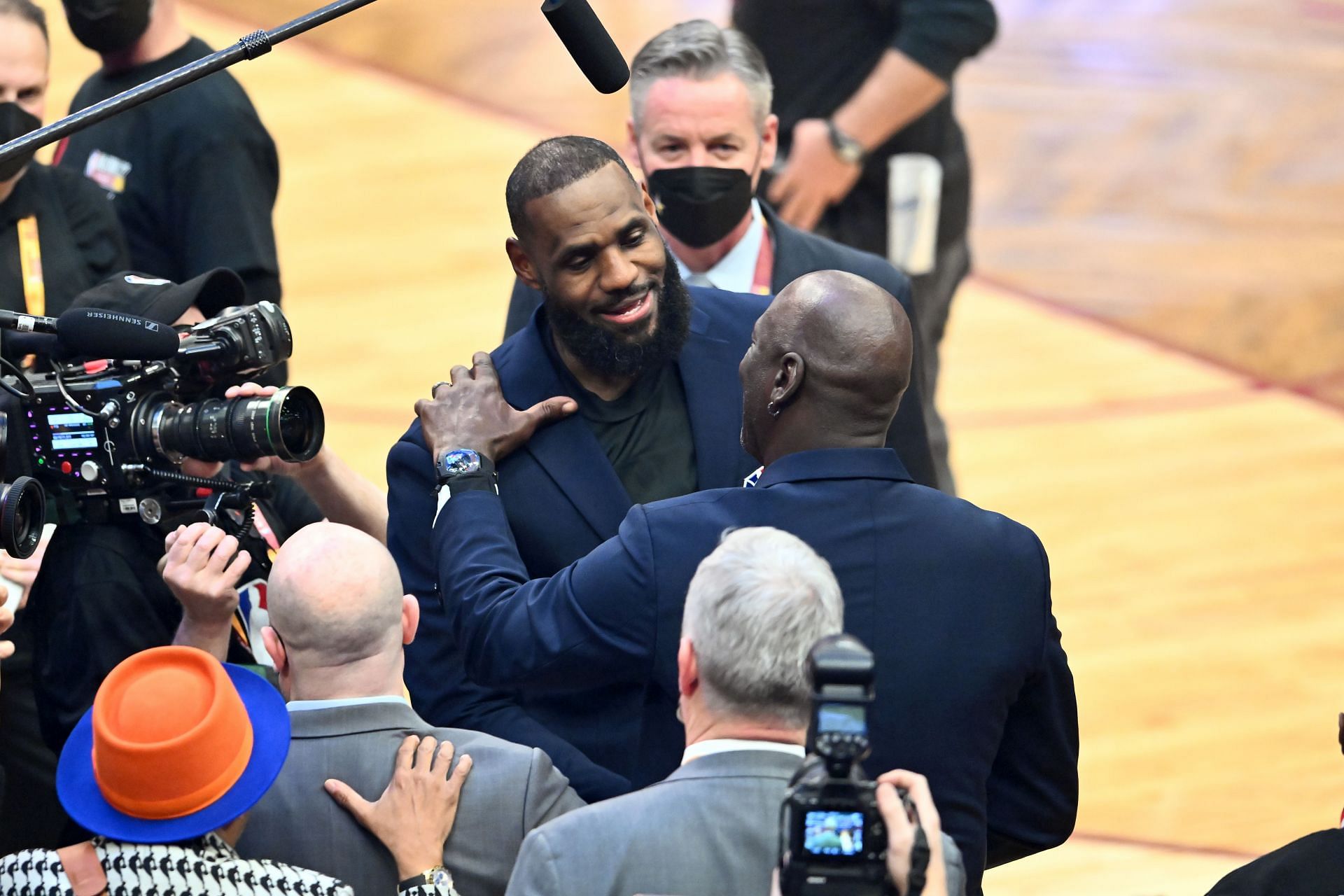 LeBron James and Michael Jordan embrace each other during the All-Star Weekend