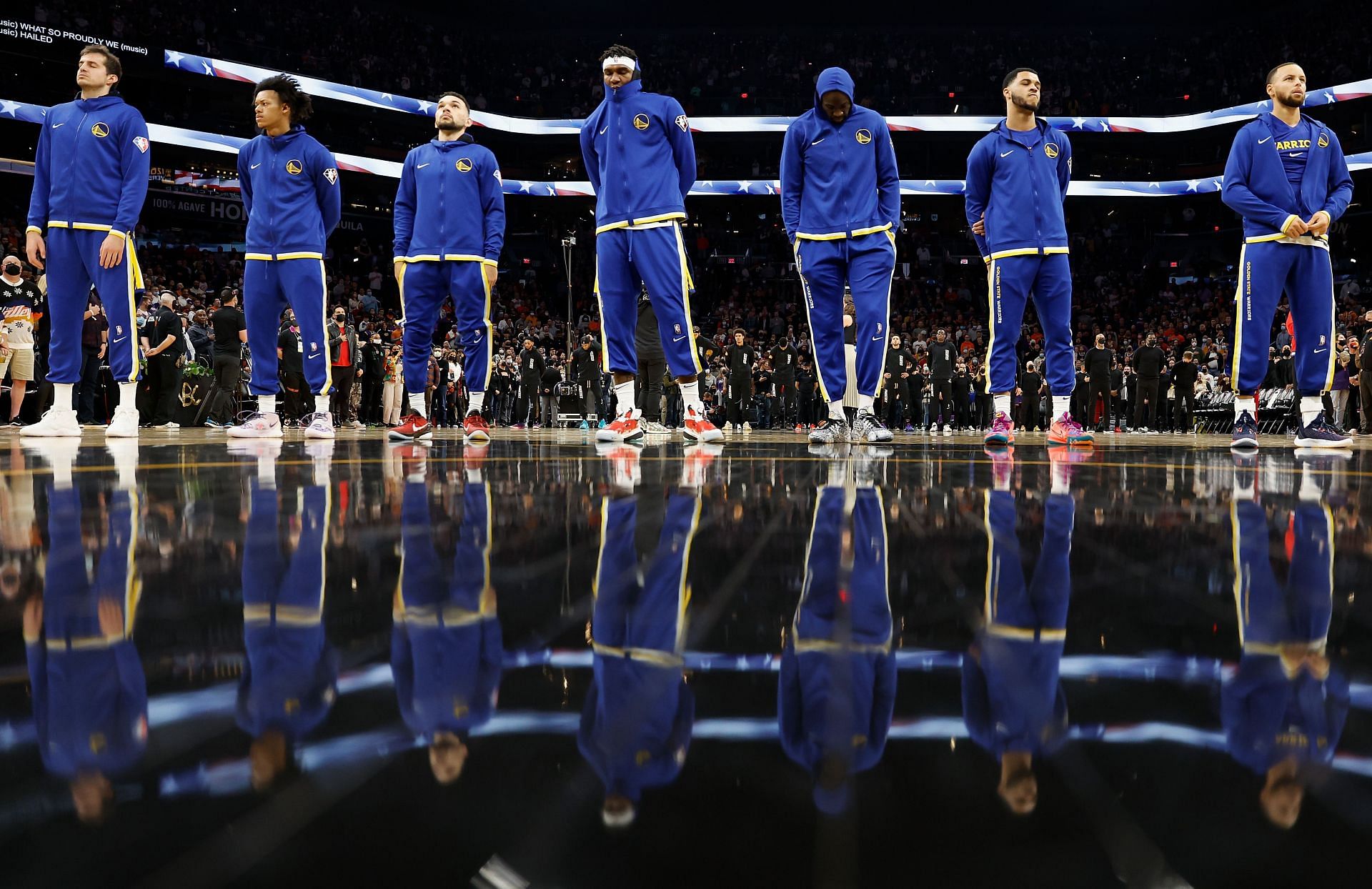 Golden State Warriors line up for the national anthem