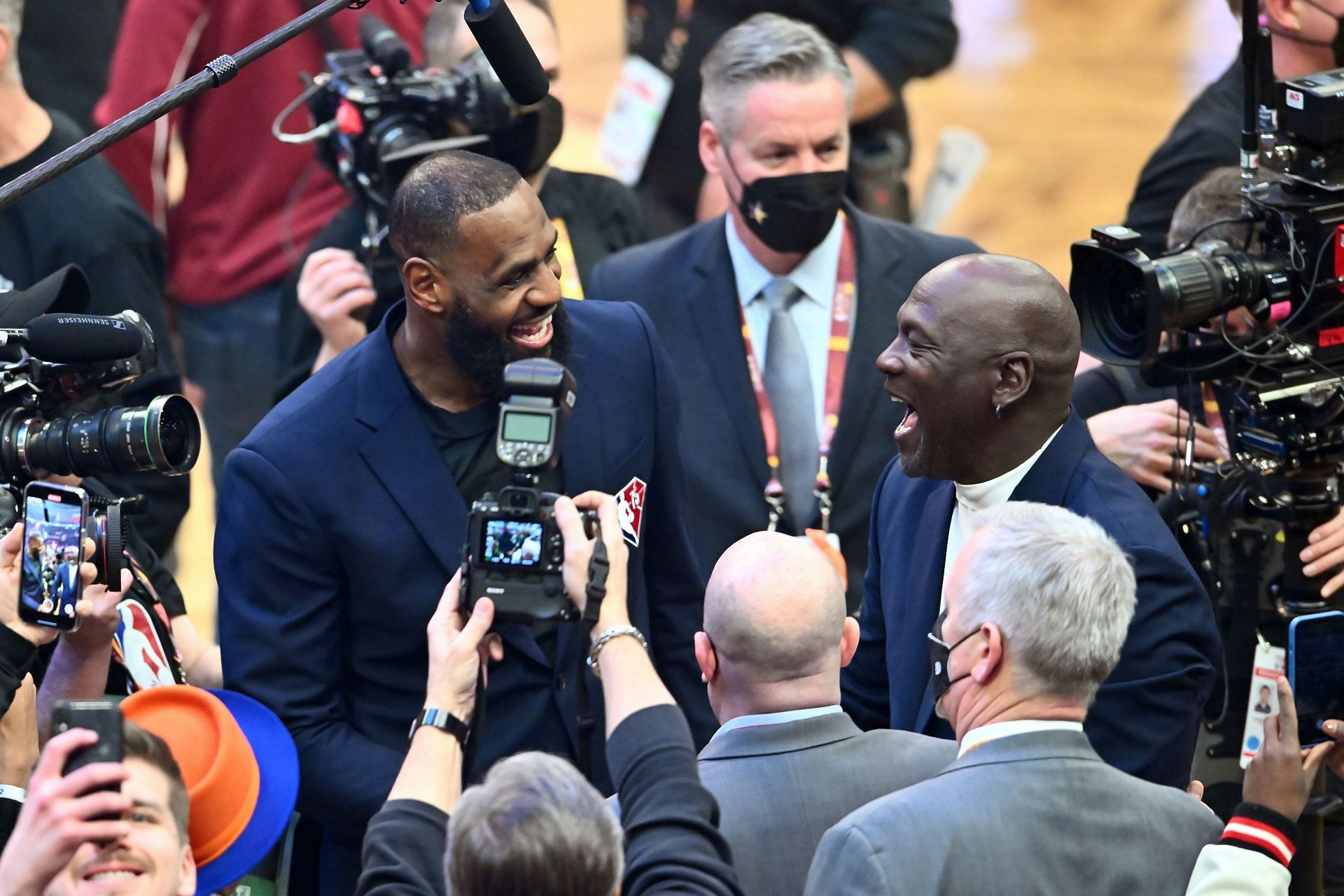 Michael Jordan and LeBron James interact after the presentation of the NBA 75th Anniversary Team