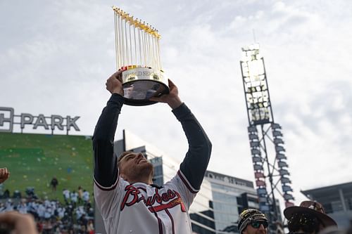 Freeman hoisting the trophy he worked so hard for