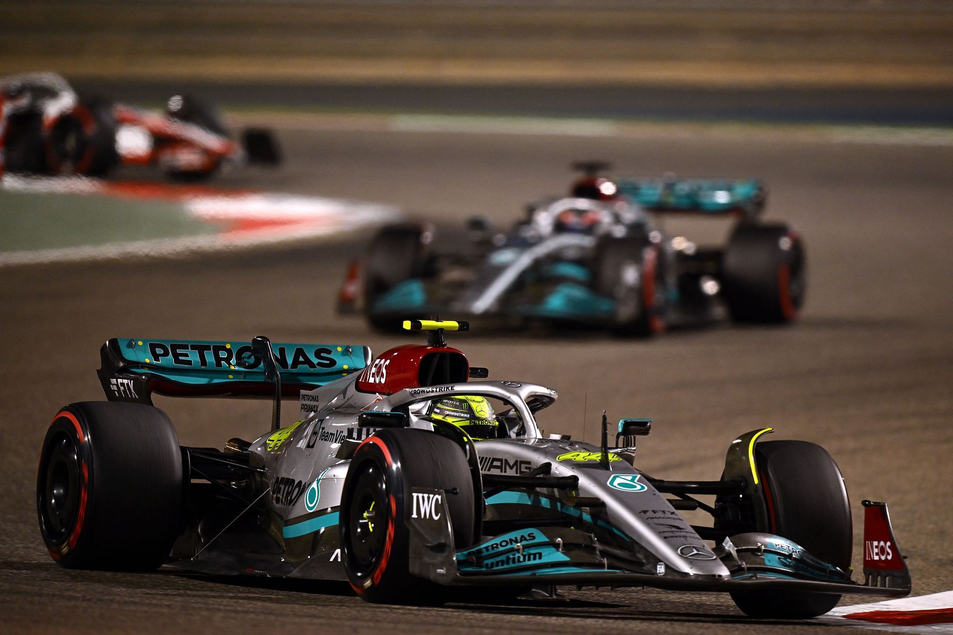 F1 Grand Prix of Bahrain - The two W13s shimmer under the Bahrain floodlights