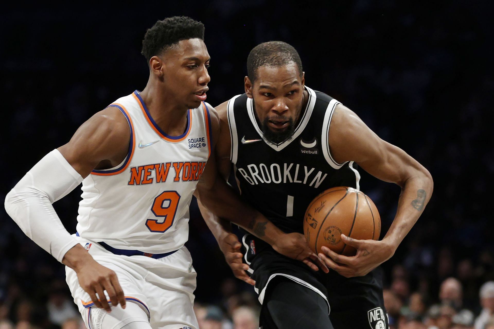 Kevin Durant of the Brooklyn Nets dribbles as RJ Barrett of the New York Knicks defends.
