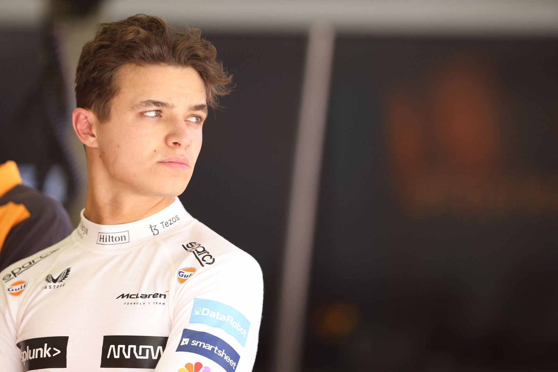 Lando Norris looks on from the garage during Day One of F1 Testing in Bahrain (Photo by Mark Thompson/Getty Images)