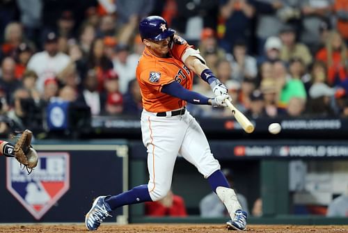 Carlos Correa hits an RBI single against the Washington Nationals during the 2019 World Series.