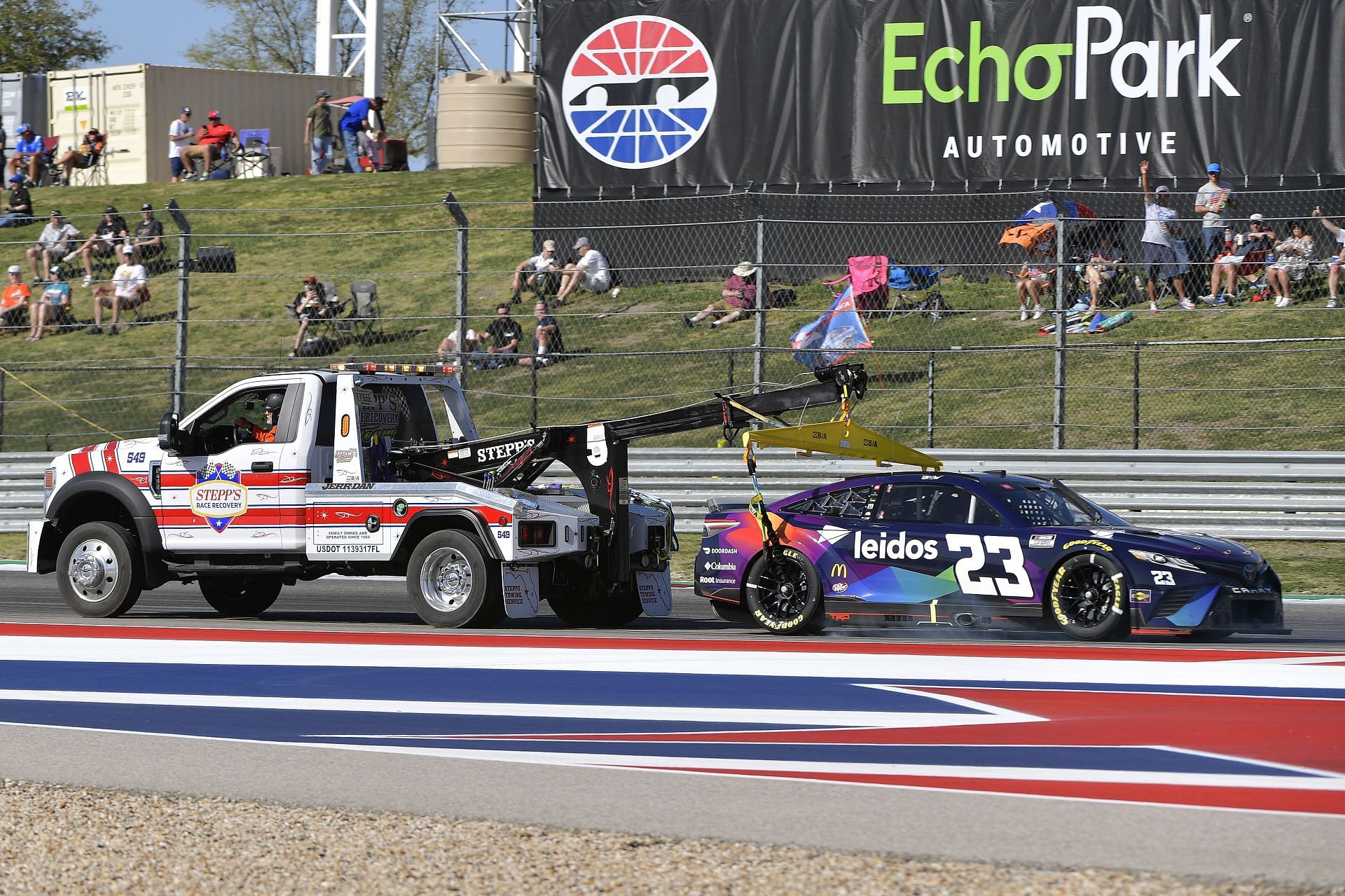 The No. 23 Toyota of Bubba Wallace Jr. being towed during the NASCAR Cup Series Echopark Automotive Grand Prix at Circuit of The Americas in Austin, Texas. (Photo by Logan Riely/Getty Images)