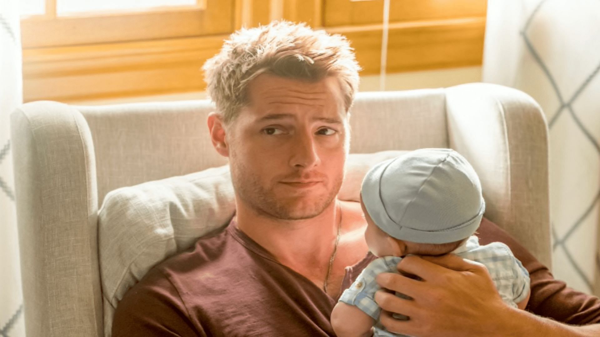 Still from NBC&#039;s This Is Us - Kevin with one of the twins (Image via NBC)