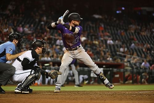 Trevor Story bats during a Colorado Rockies v Arizona Diamondbacks game