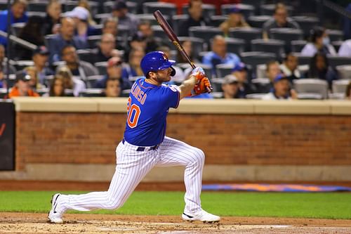 Pete Alonso swings at a pitch during a Miami Marlins v New York Mets game