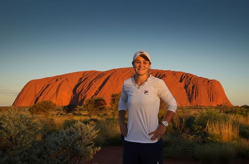 Ashleigh Barty poses as she visits Uluru in the Uluru-Kata Tjuta National Park