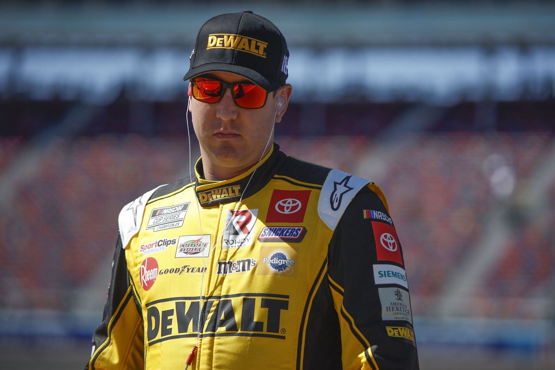 Kyle Busch waits on the grid during practice for the Ruoff Mortgage 500 at Phoenix Raceway.