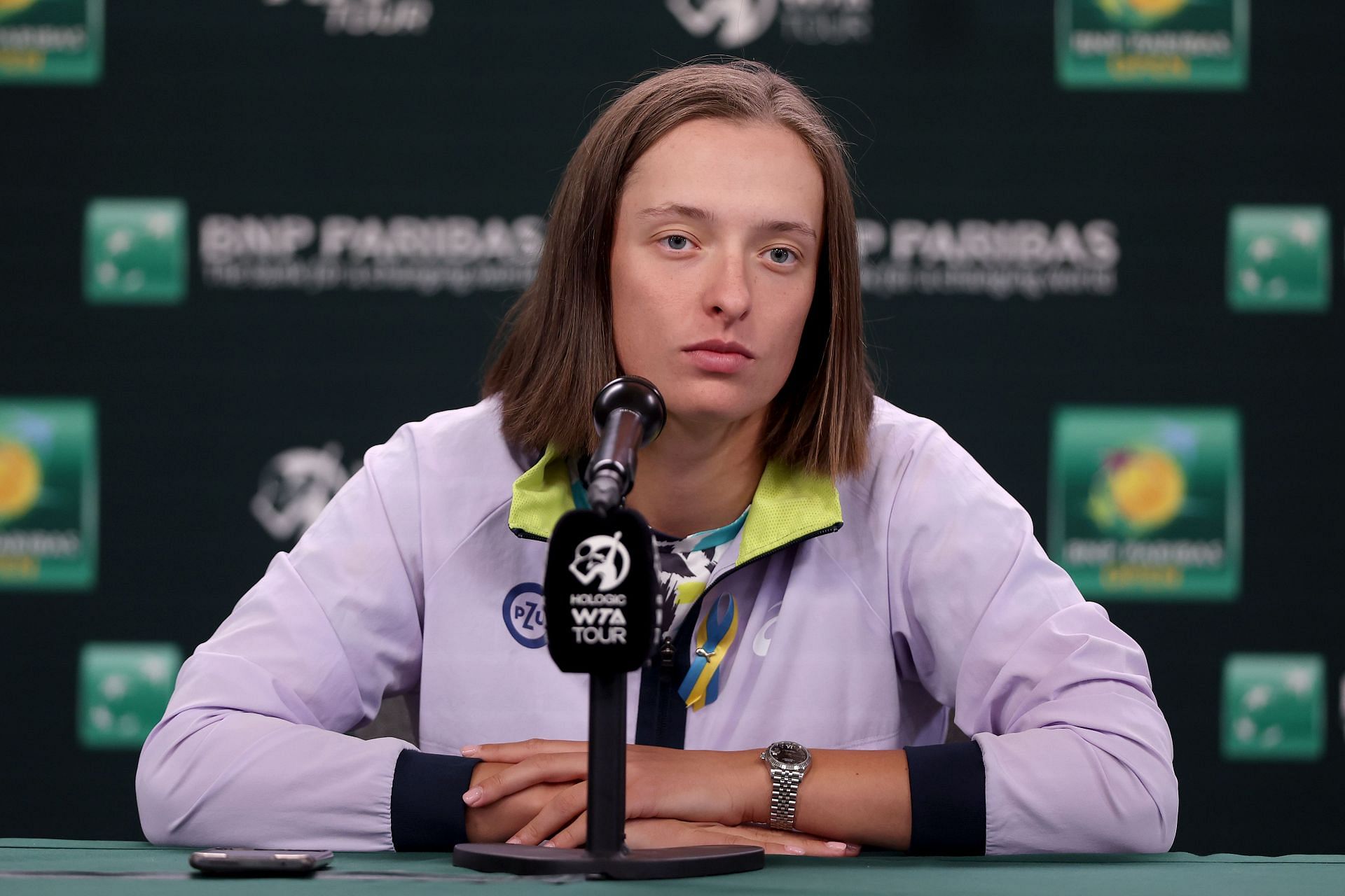 Iga Swiatek with the ribbon at a BNP Paribas Open press conference