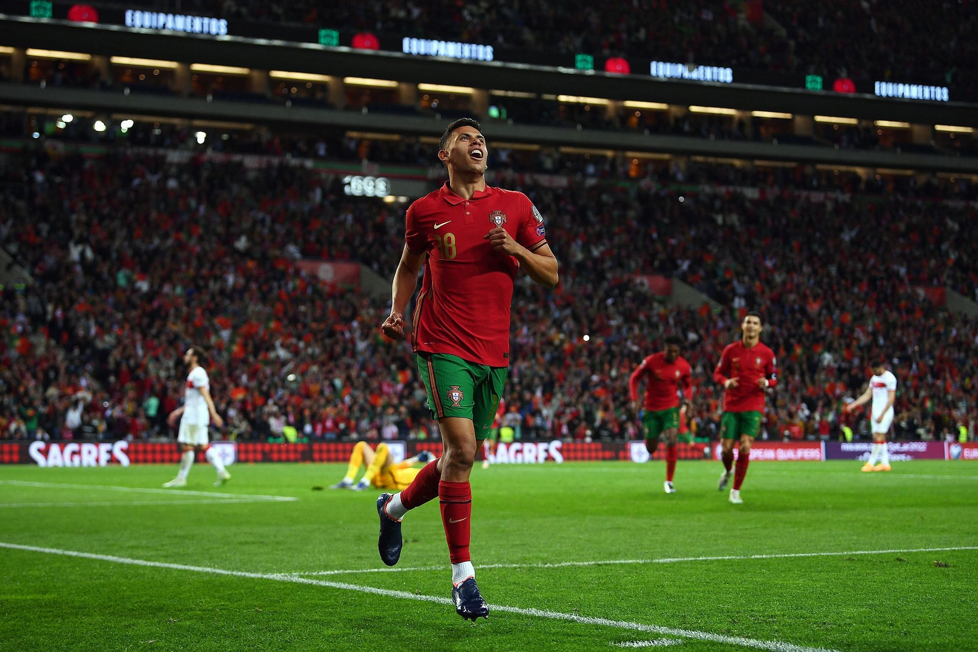 Matheus Nunes rejoices after scoring a goal.