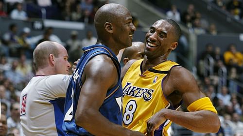 Bryant and Jordan sharing a laugh after the offensive foul