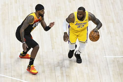 LeBron James of the LA Lakers drives into Royce O'Neale of the Utah Jazz.