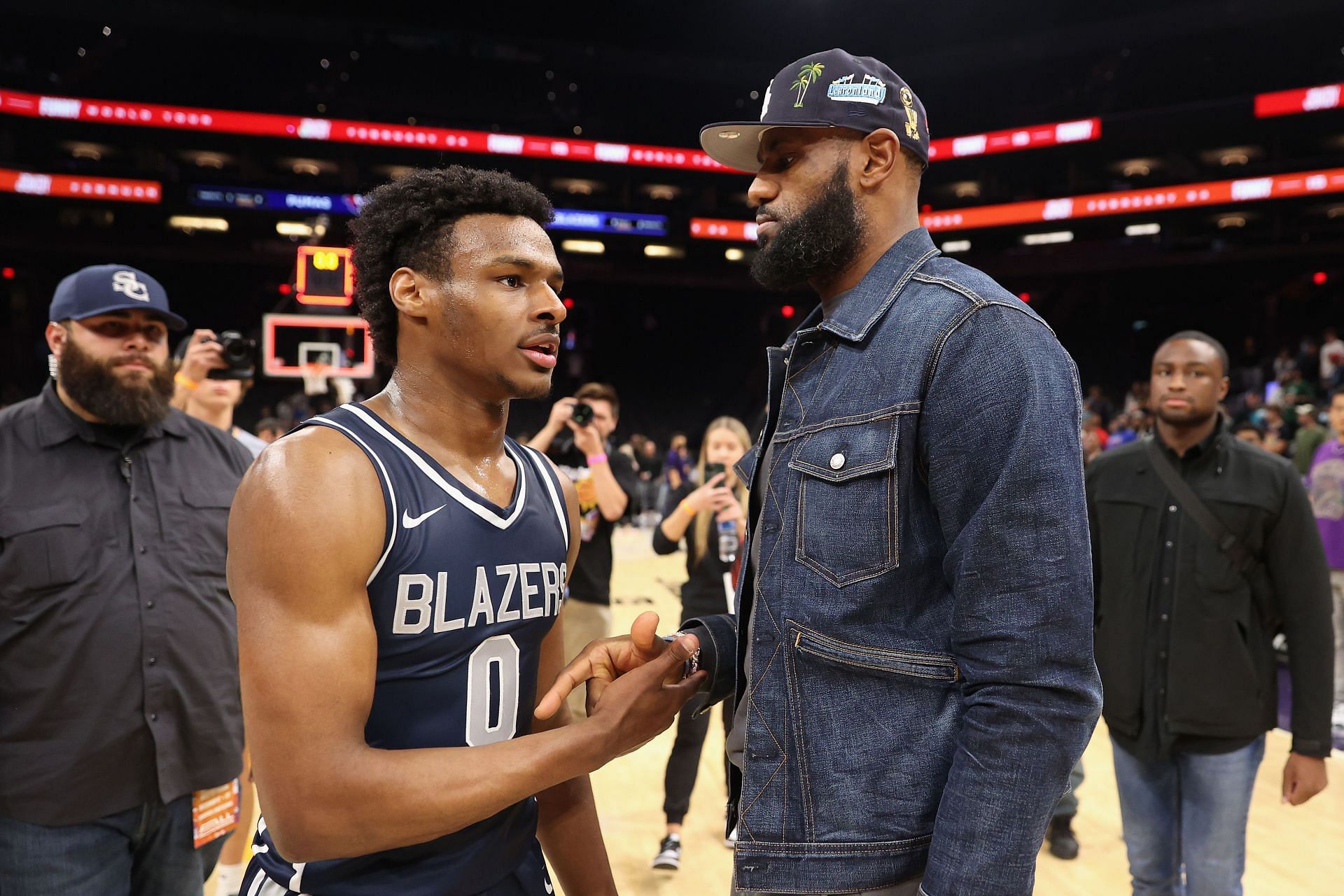 Bronny James of the Sierra Canyon Trailblazers is greeted by his father, NBA star LeBron James.