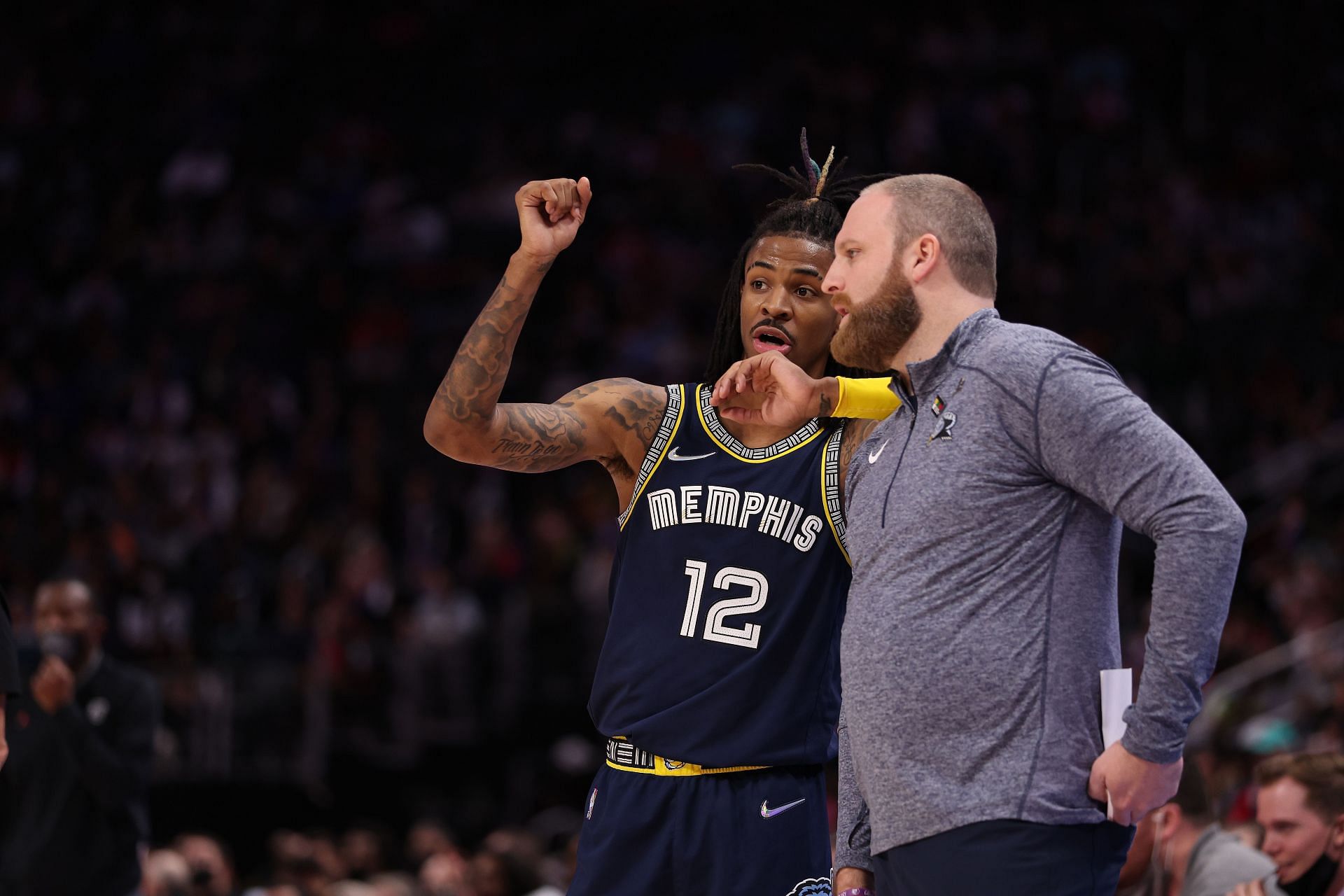 Ja Morant of the Memphis Grizzlies talks with head coach Taylor Jenkins