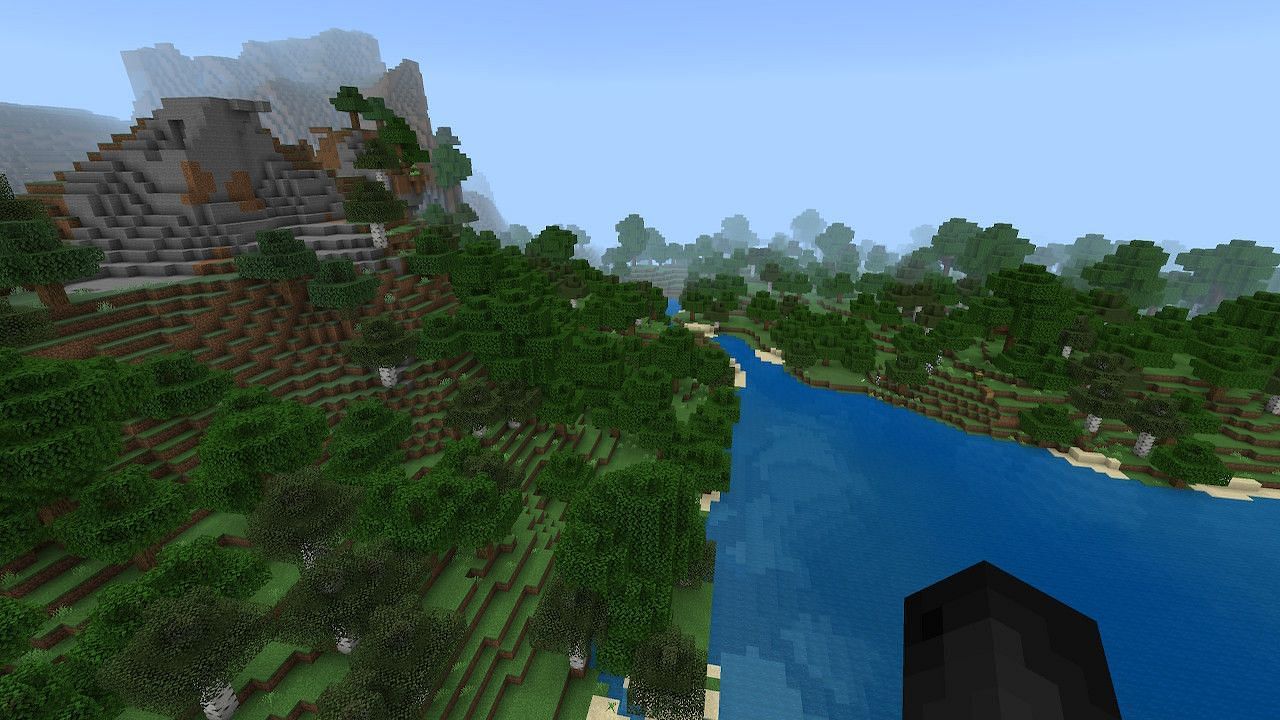 Players can access a gigantic cave and ruined portal just a short walk from spawn (Image via Minecraft)