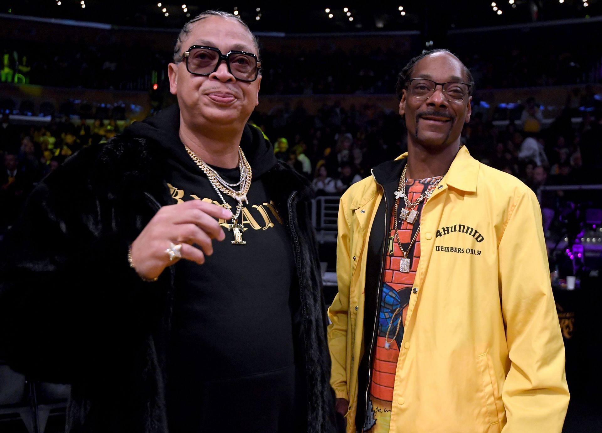 Snoop Dogg, right, and manager Big Percy courtside before the game between the Golden State Warriors and the LA Lakers at Staples Center on January 21, 2019, in Los Angeles, California.