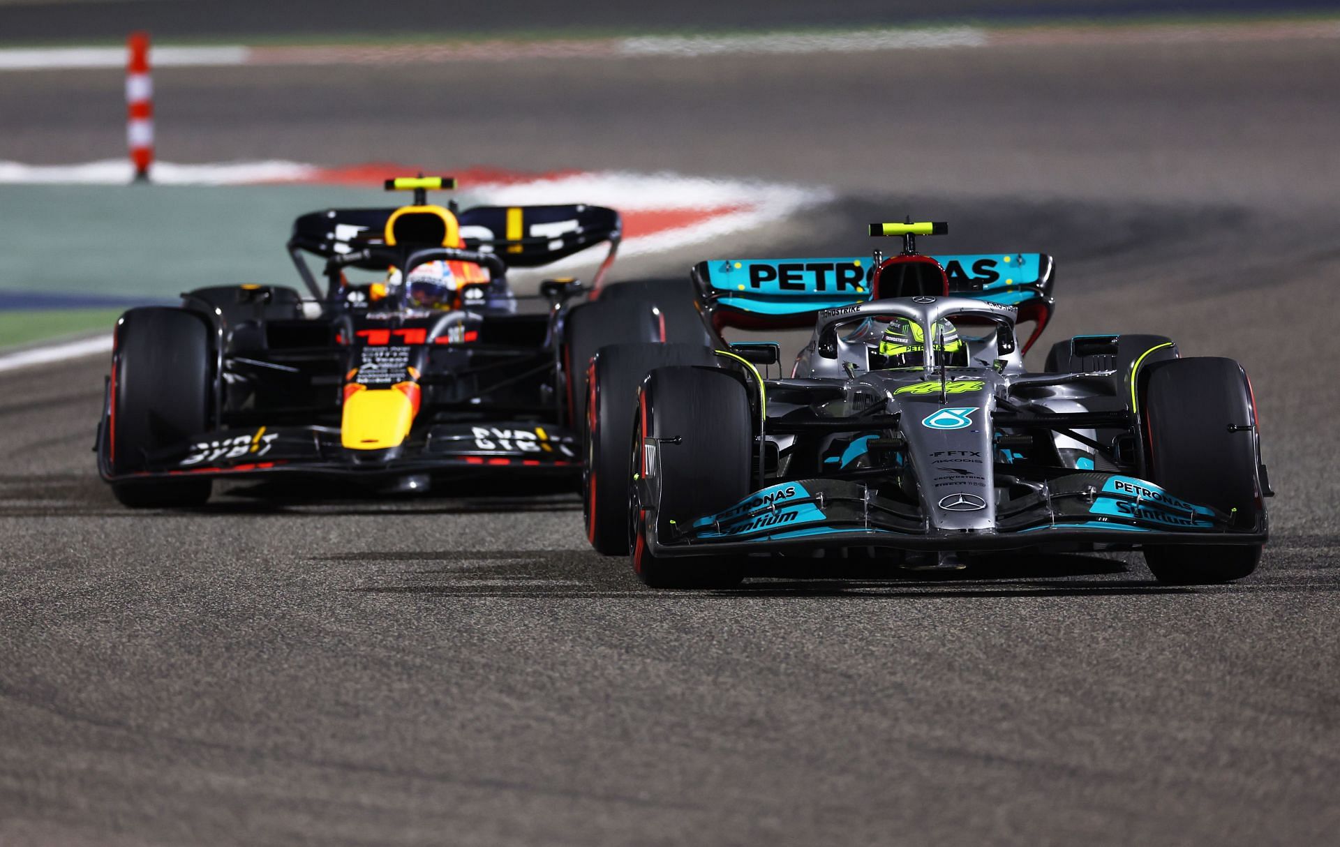 Mercedes&#039; Lewis Hamilton overtaking Red Bull in 2022 Bahrain Grand Prix. (Image via Lars Baron/Getty Images)