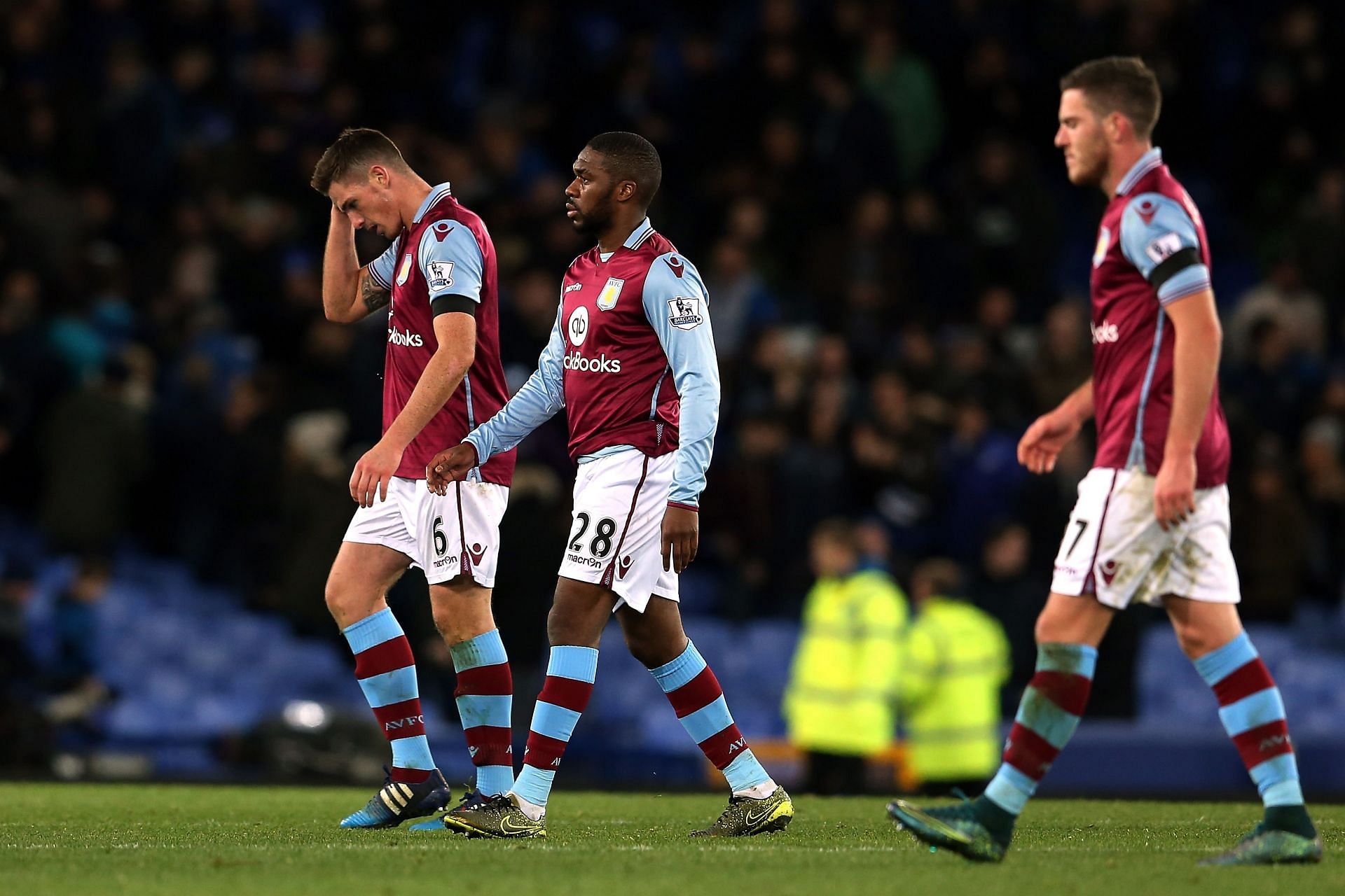 Aston Villa players feeling dejected after a loss against Everton