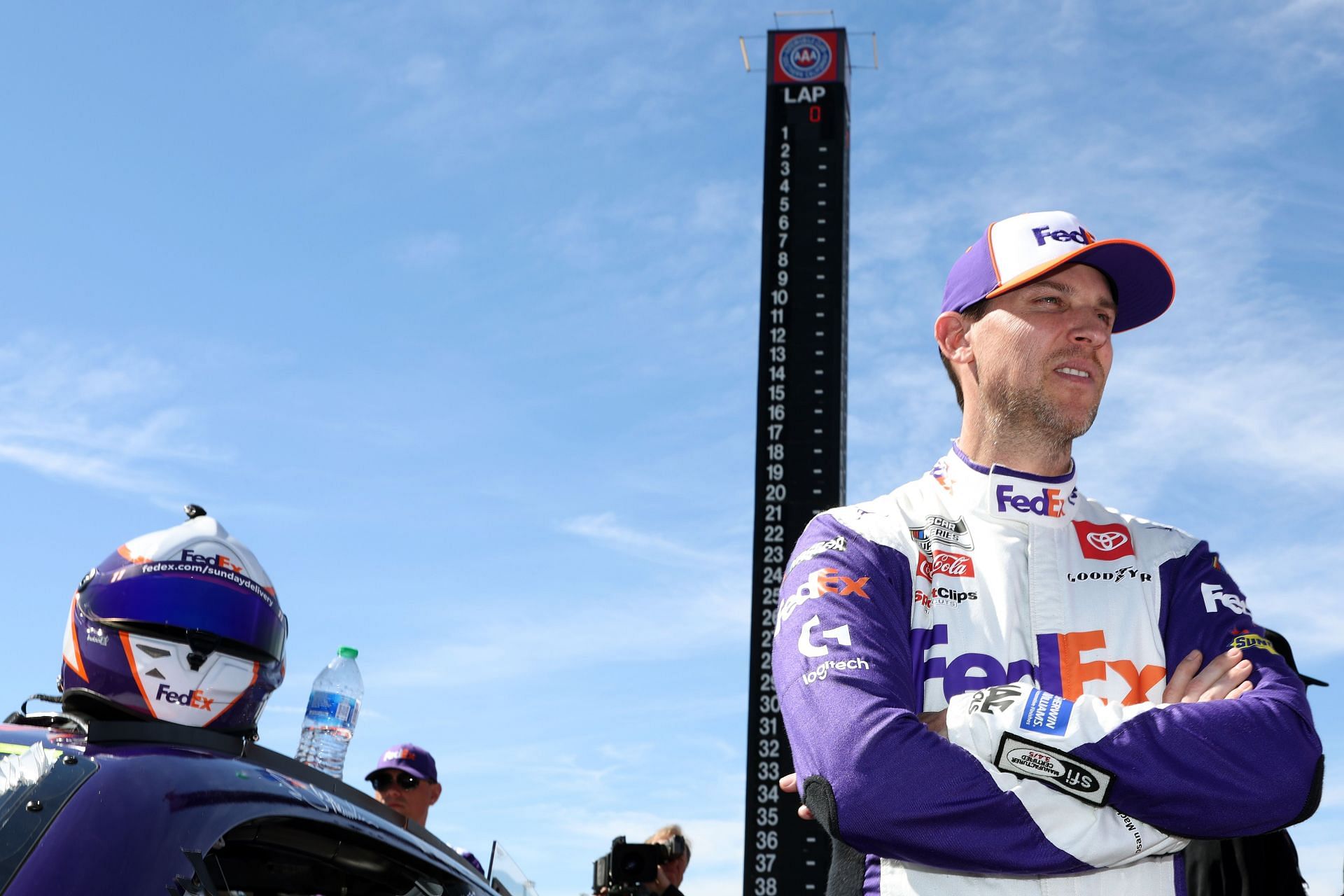 Denny Hamlin waits on the grid prior to the NASCAR Cup Series Wise Power 400 at Auto Club Speedway.