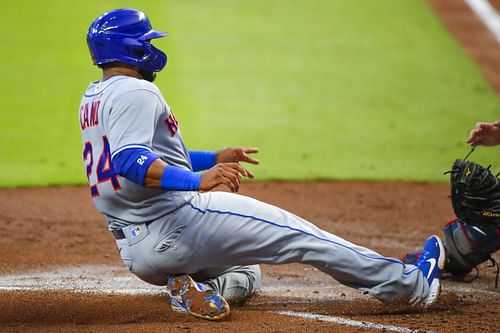 Robinson Cano gets tagged out in the fourth inning against the Atlanta Braves at Truist Park in on August 3, 2020