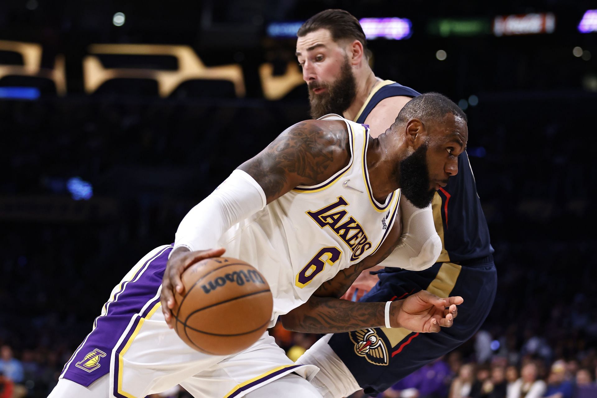 LeBron James of the LA Lakers drives against Jonas Valanciunas of the New Orleans Pelicans.