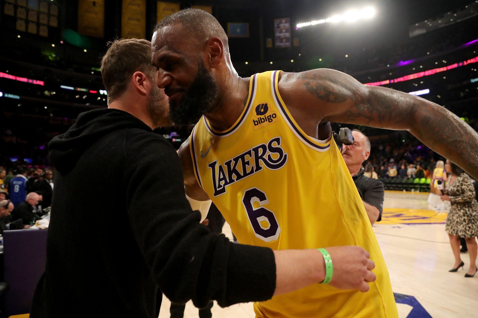 LA Rams quarterback Matthew Stafford and LeBron James hug after the latter dropped 56 points on Steph Curry and the Golden State Warriors. [Photo: USA Today]