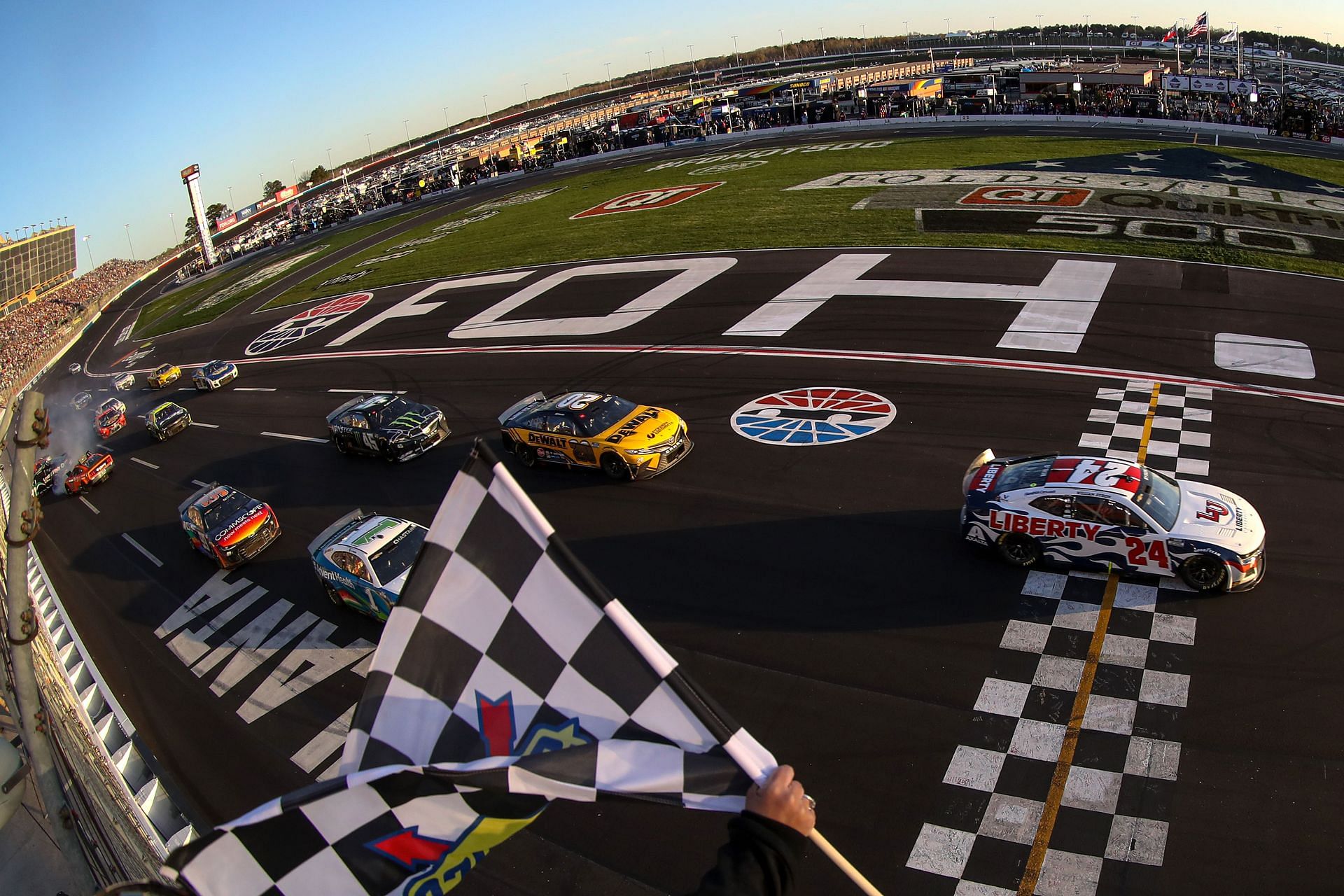 William Byron takes the checkered flag to win the NASCAR Cup Series Folds of Honor QuikTrip 500 at Atlanta Motor Speedway (Photo by Mike Mulholland/Getty Images)