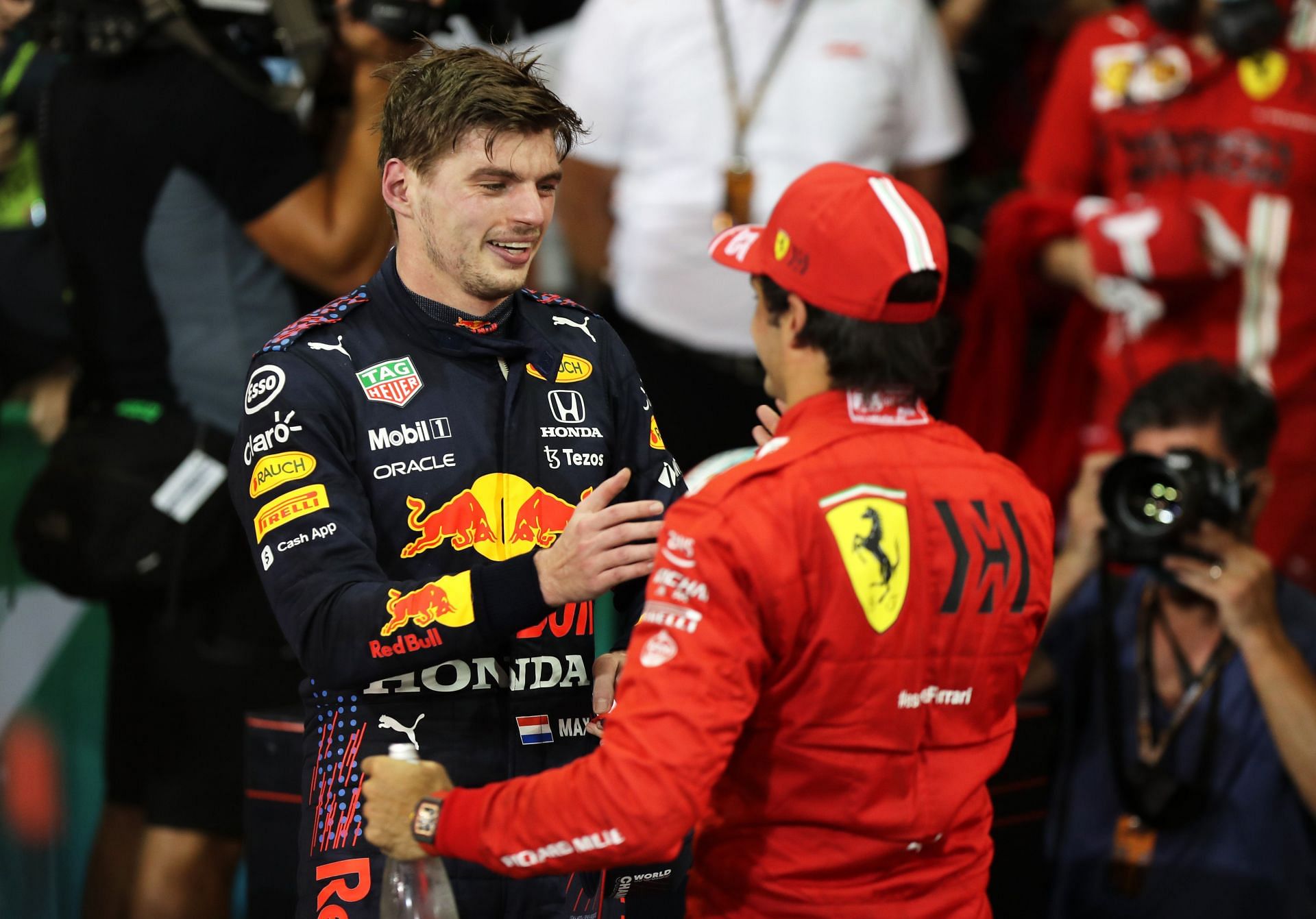 Max Verstappen (left) congratulated by Carlos Sainz (right) after winning the 2021 drivers&#039; world championship in Abu Dhabi (Photo by Kamran Jebreili - Pool/Getty Images)
