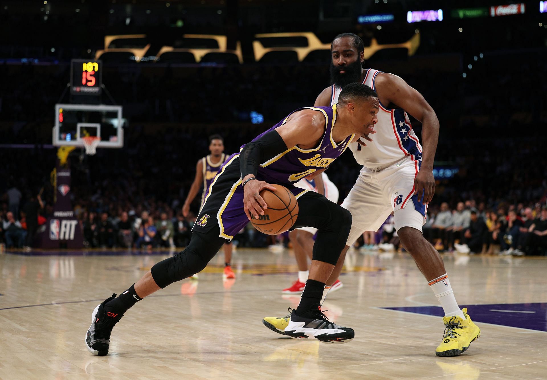 Russell Westbrook #0 of the Los Angeles Lakers drives to the basket past James Harden #1 of the Philadelphia 76ers during a 126-121 76ers win at Crypto.com Arena on March 23, 2022 in Los Angeles, California.