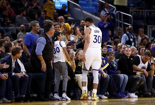 Steph Curry of the Golden State Warriors interacting with fans