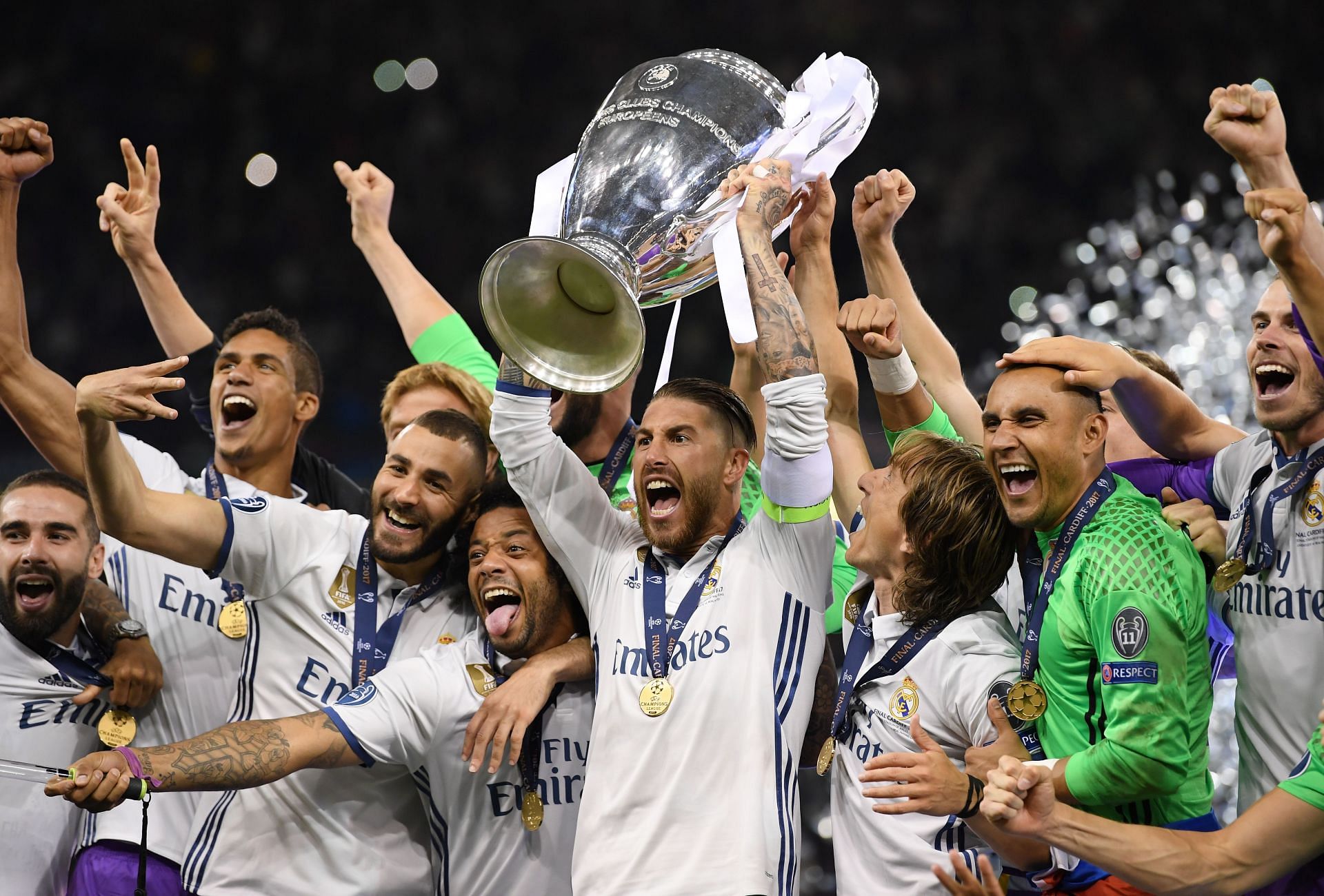 Real Madrid players celebrate with the trophy after overcoming Juventus in the final.
