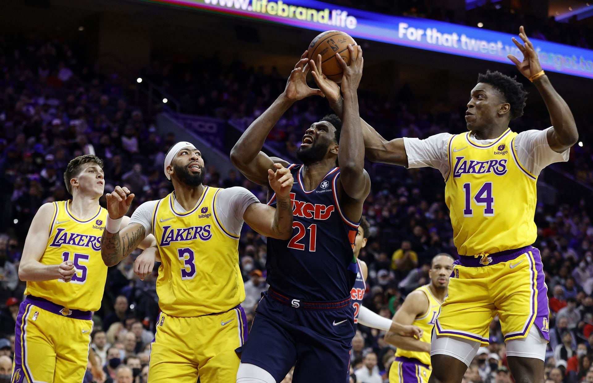 Joel Embiid of the Philadelphia 76ers against Anthony Davis and Stanley Johnson of the LA Lakers