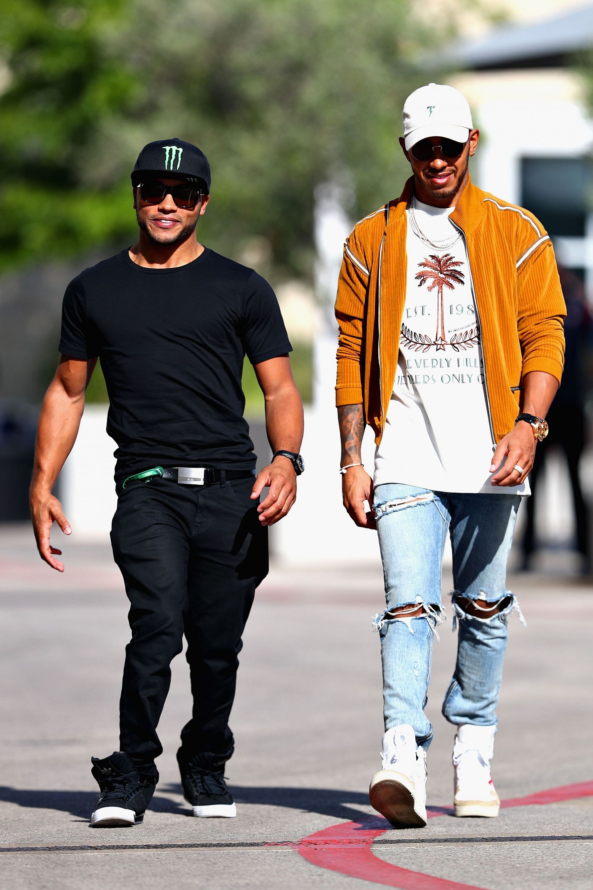 Lewis Hamilton (right) shared pictures of him celebrating his brother&#039;s (left) 30th birthday on social media