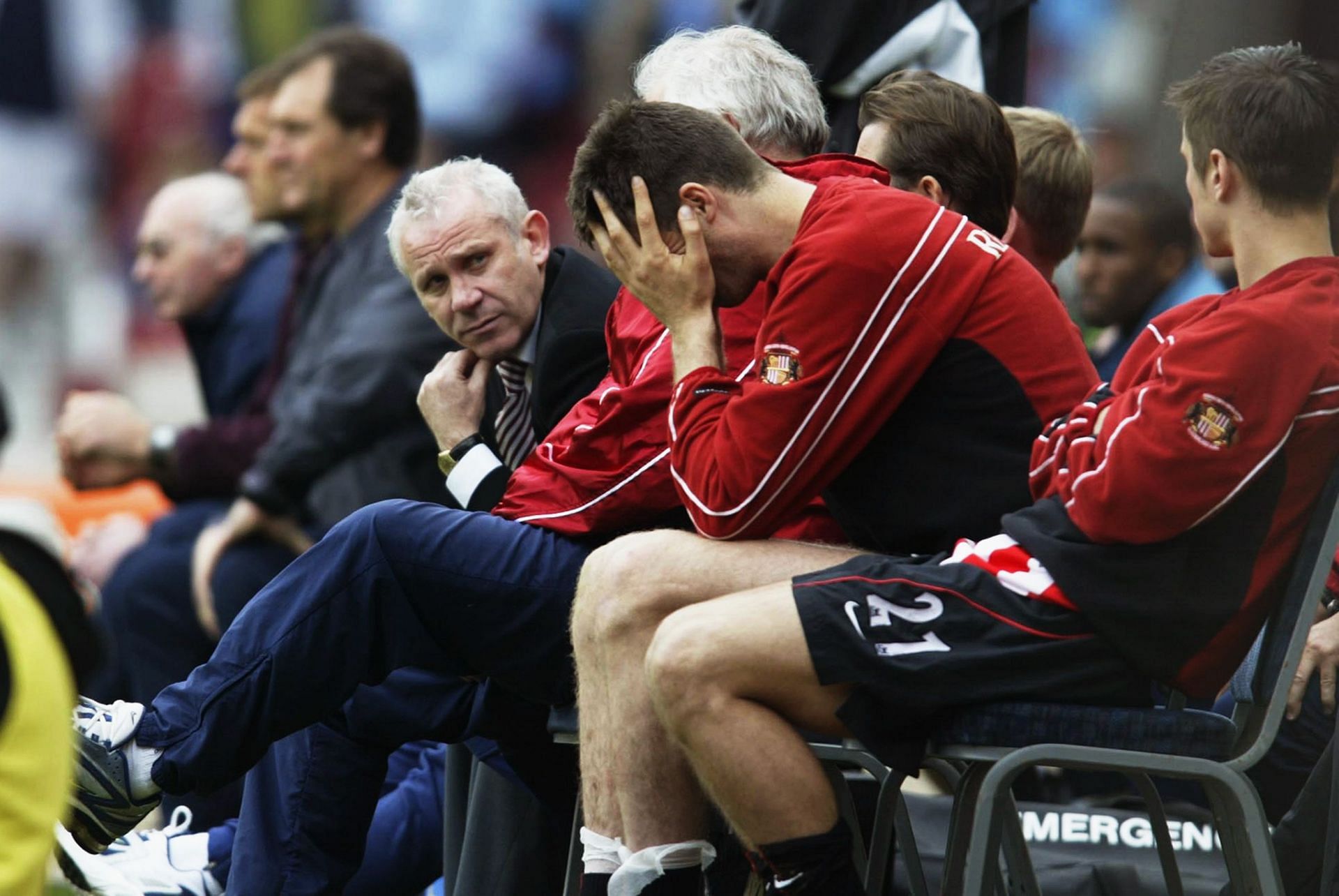 Sunderland manager Peter Reid looks on as Niall Quinn of Sunderland holds his head