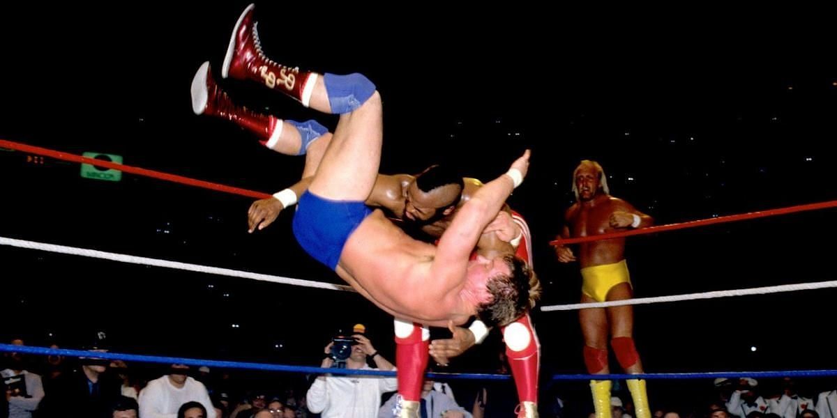 Mr. T slams Roddy Piper as Hulk Hogan looks on