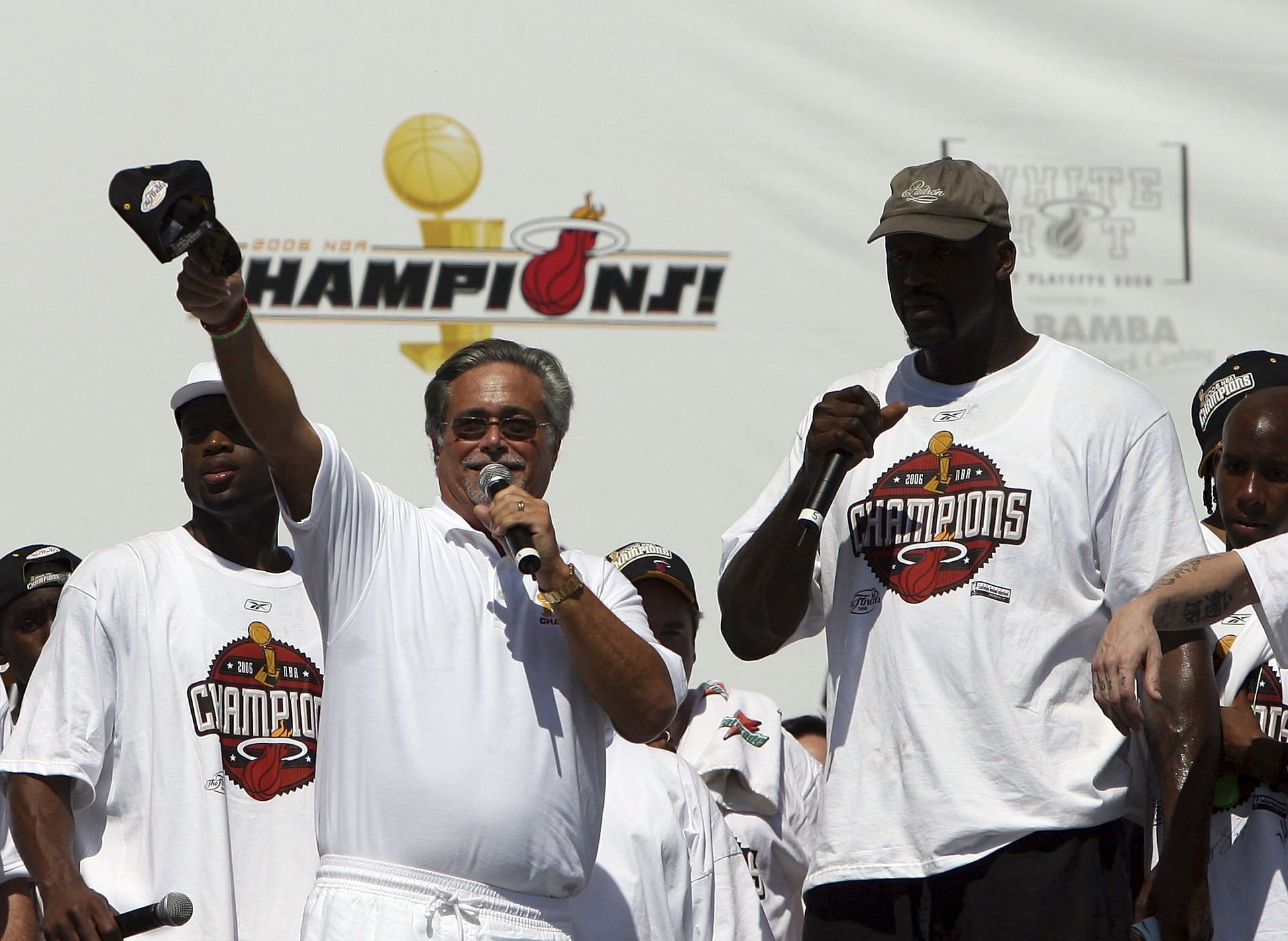 Enter caption Enter caption Enter caption Enter caption Team owner Micky Arison (L) and Shaquille O&#039;Neal, right, of the Miami Heat celebrate during their victory parade.