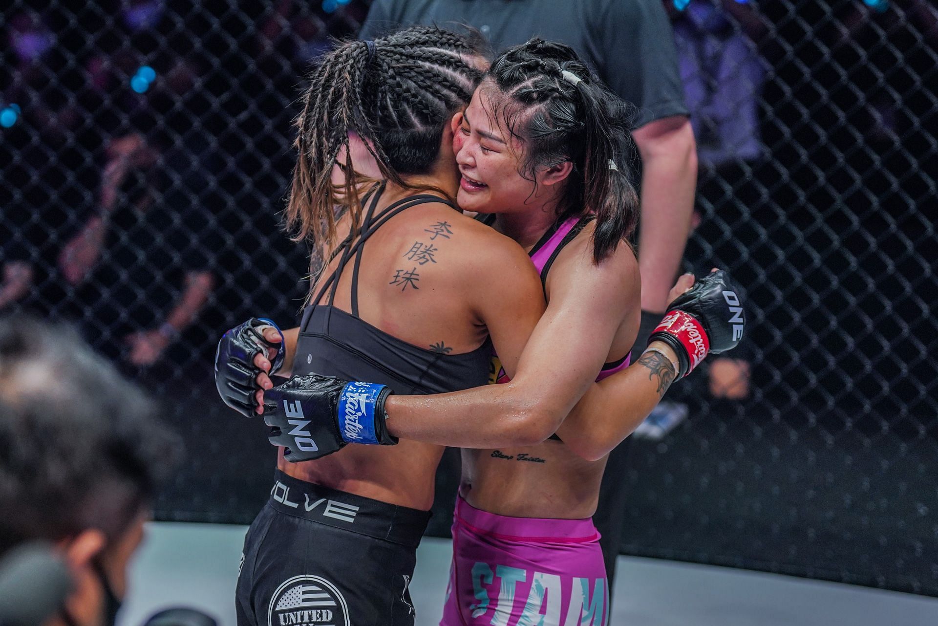 Stamp Fairtex hugs Angela Lee after ONE women&#039;s atomweight world title fight in the main event of ONE X. [Photo ONE Championship]