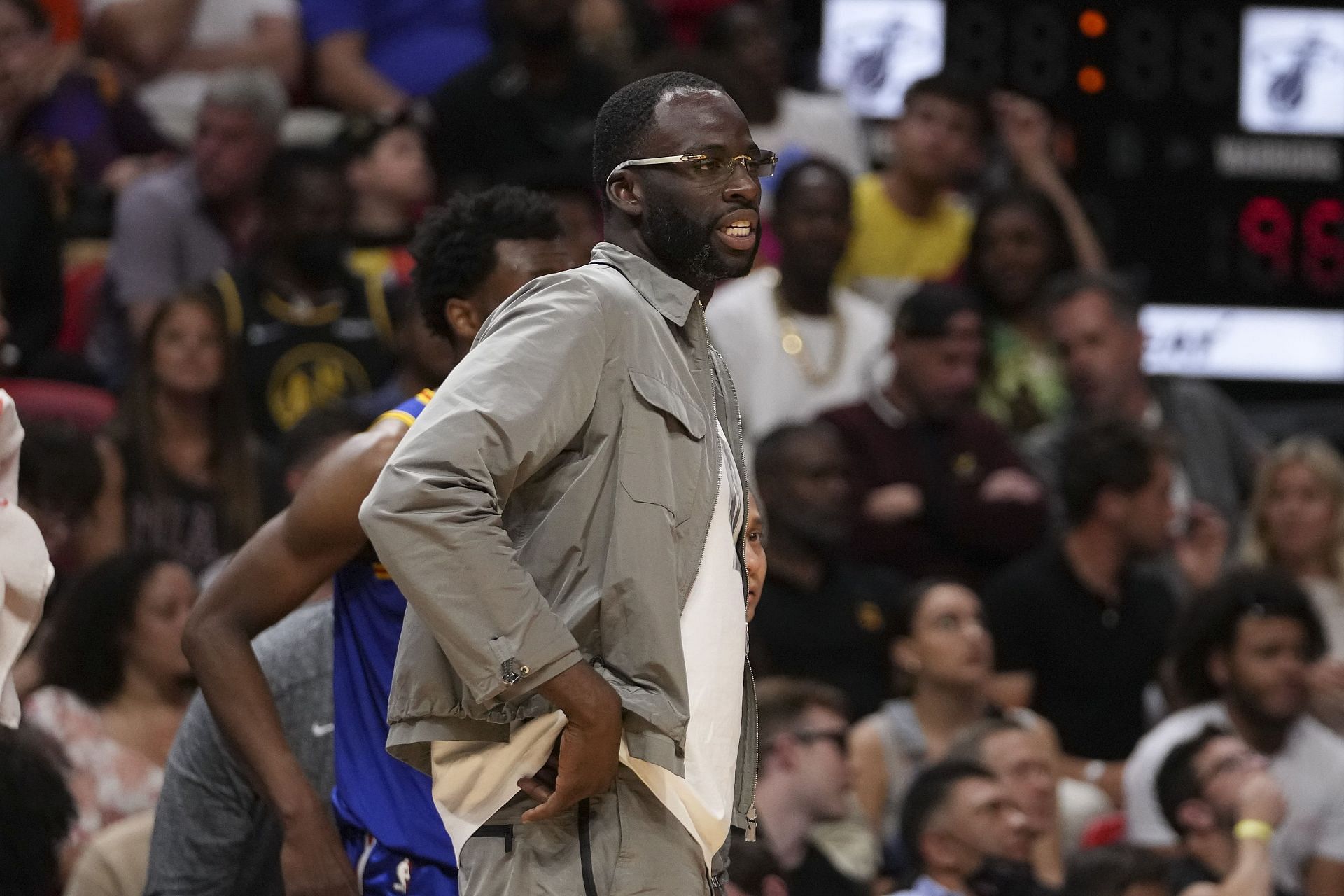 Draymond Green of the Golden State Warriors looks on from the sidelines.