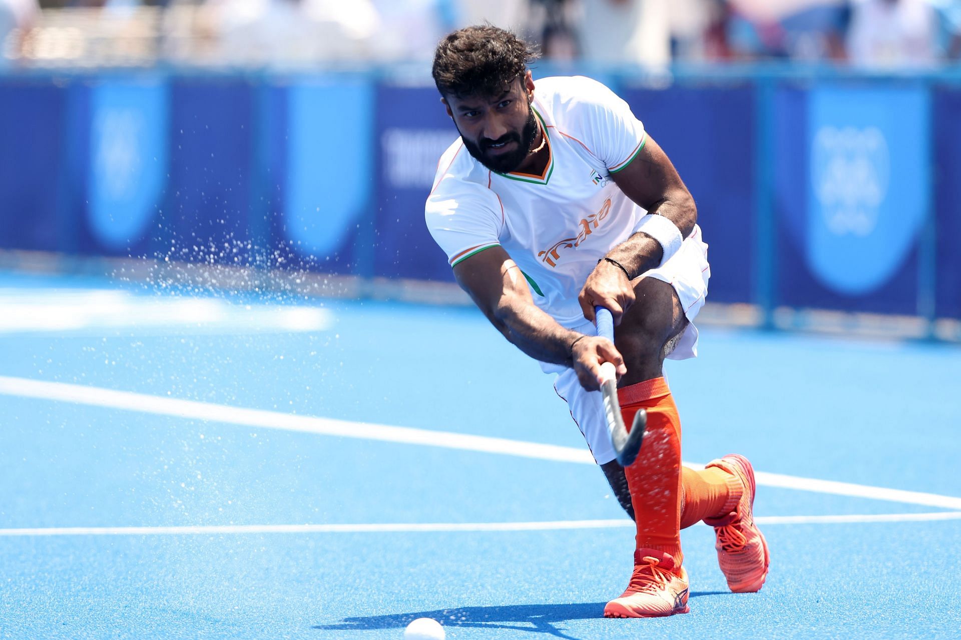 Hockey - Olympics: Defender Surender Kumar in action