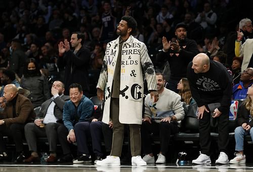 Brooklyn Nets star Kyrie Irving (standing) not playing at home due to NYC's vaccine mandate