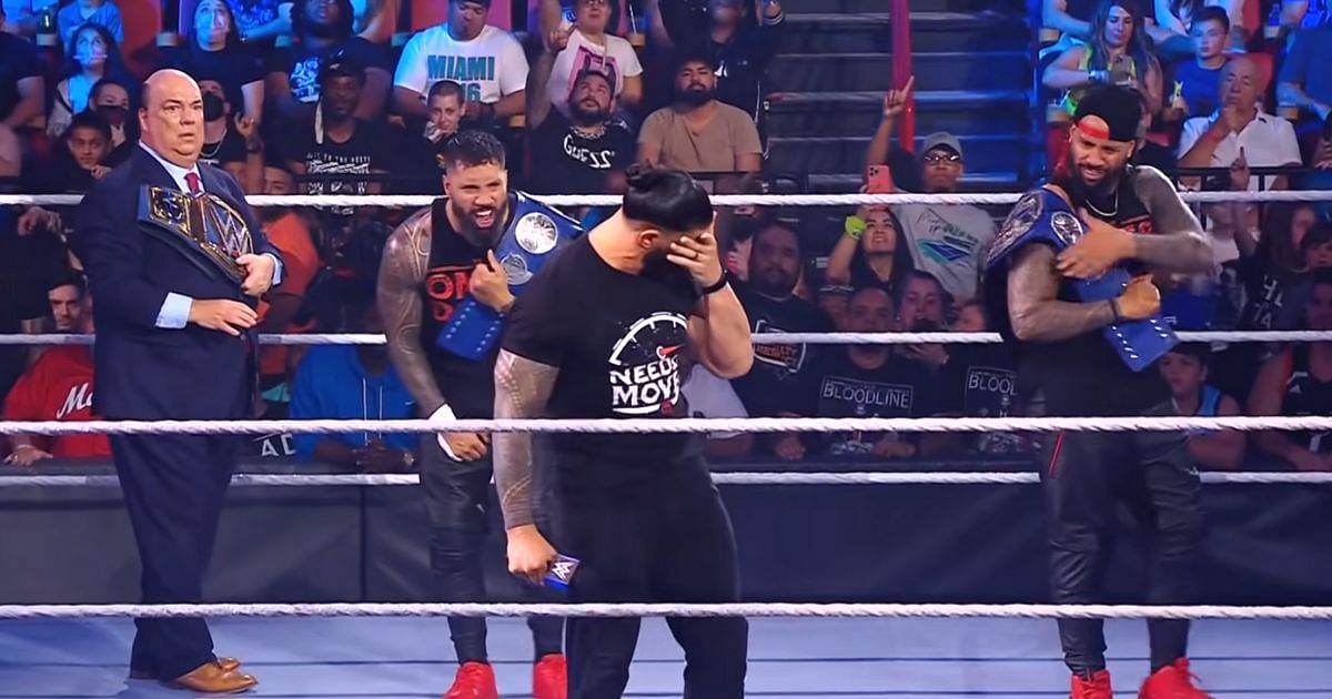 Paul Heyman, Reigns, and The Usos during their SmackDown segment.