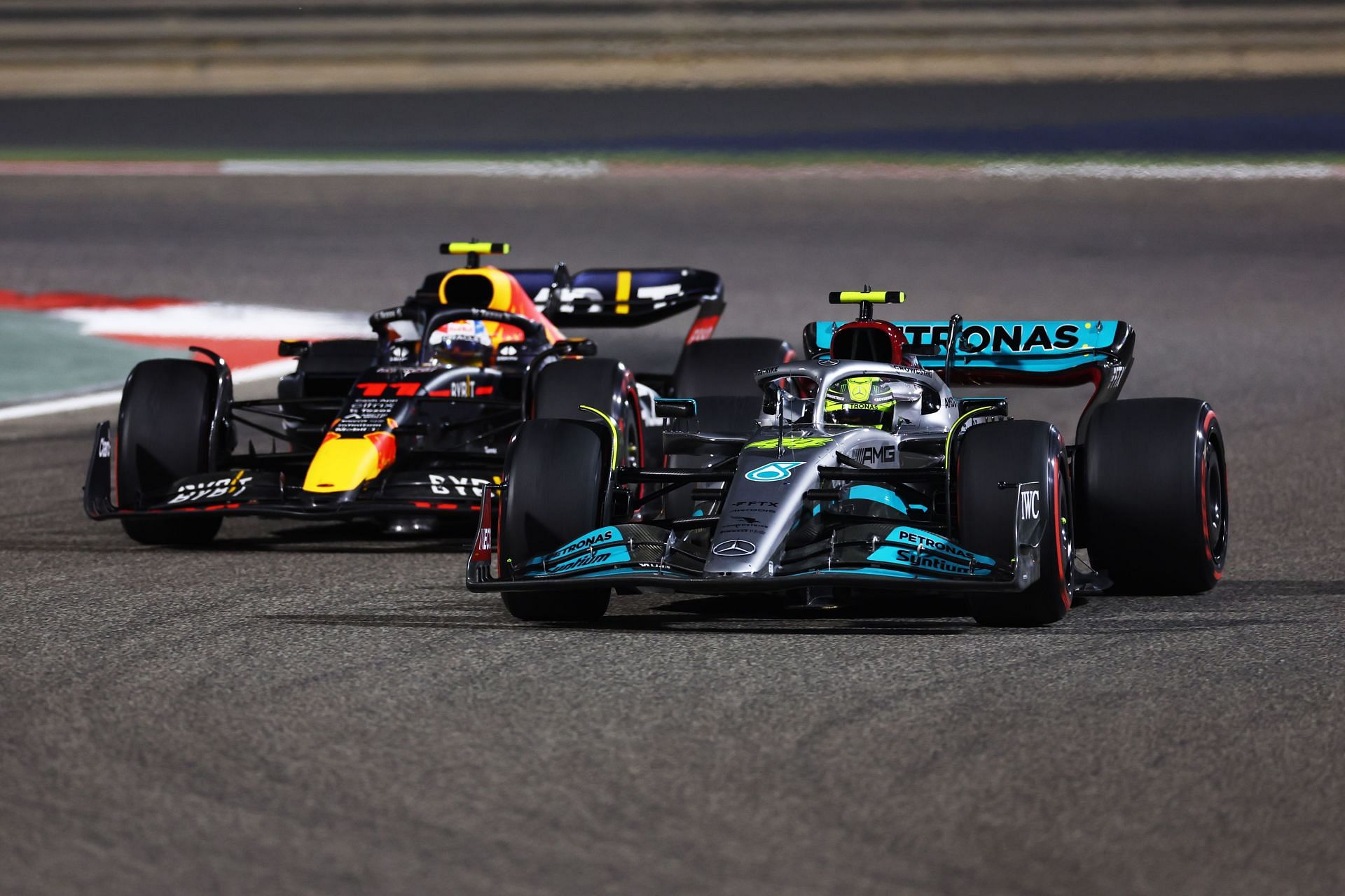 Lewis Hamilton (44) Mercedes W13 defending against a much quicker Sergio Perez (11) Red Bull Racing RB18, 2022 Bahrain Grand Prix