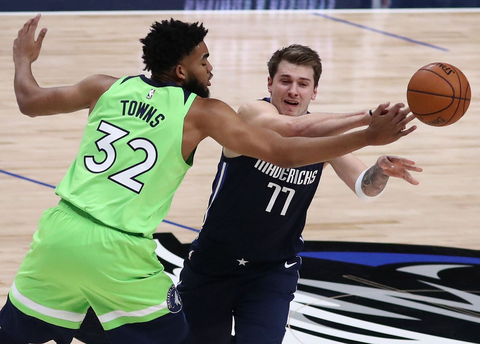 Luka Doncic of the Dallas Mavericks against Karl-Anthony Towns of the Minnesota Timberwolves